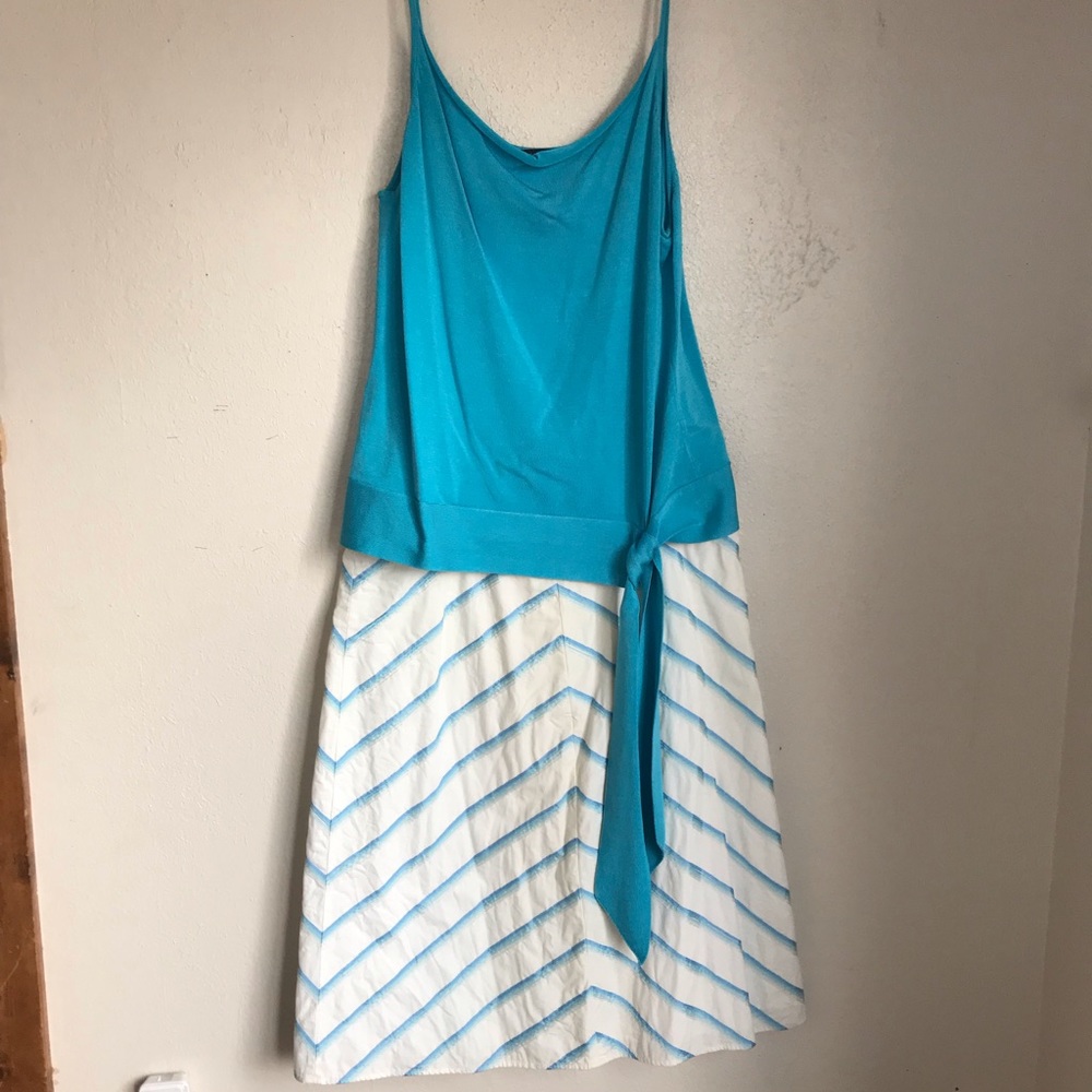 Turquoise tank and A line skirt.